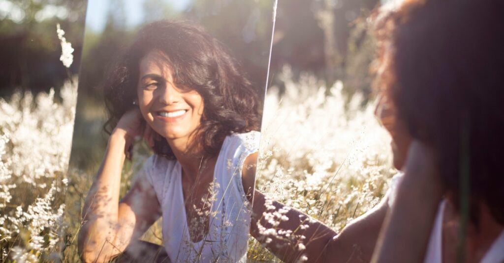 A person smiling into a mirror. 